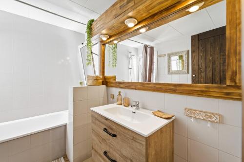 a bathroom with a sink and a mirror at MY ALVA PARK - 50m from the beach in Lloret de Mar