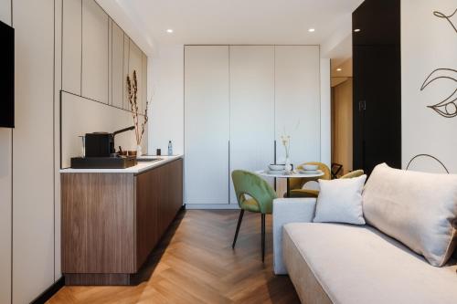 a living room with a couch and a table at Ferdinand Boutique in Cluj-Napoca