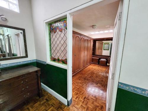 a hallway of a home with a stained glass door at Kulem Gempol in Bandung