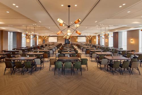 a large banquet hall with tables and chairs at Van der Valk Hotel Groningen-Hoogkerk in Groningen