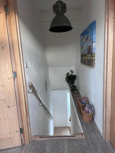 a bathroom with a bath tub in a room at 't lant van Texsel in De Koog
