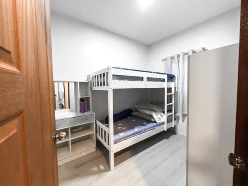 a bedroom with two bunk beds in a room at Davon- Doña Soledad in Polon