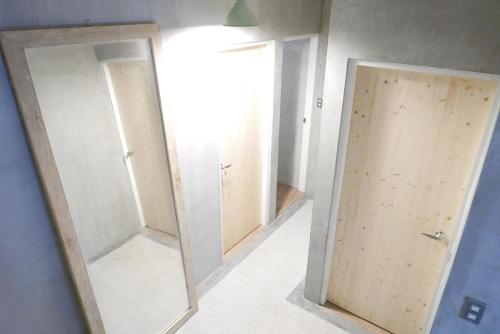 a row of mirrors in a room at MatchBox Hostel in Longjing