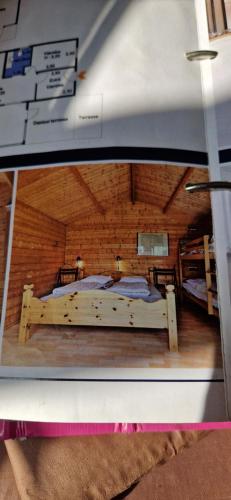 a model of a bedroom with a bed in a room at Bogø feriehus in Bogø By