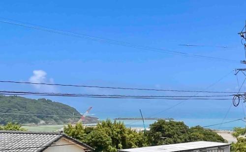 a view of the ocean from a house at VOYAGE Beautiful sunrise ocean view BEDROOM whole house, 2 rooms on 2nd floor, tatami room on 1st floor, &private garage in Hyuga