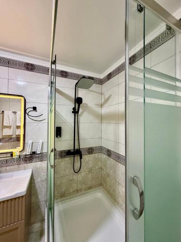 a bathroom with a bath tub and a shower at Isakhoja Boutique Hotel in Khiva