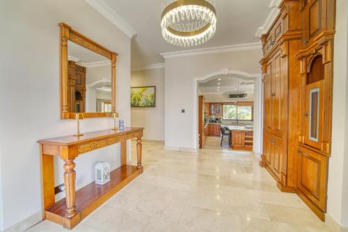 a home office with a wooden desk and a mirror at Sunset Poseidon by Carrington in Kyrenia