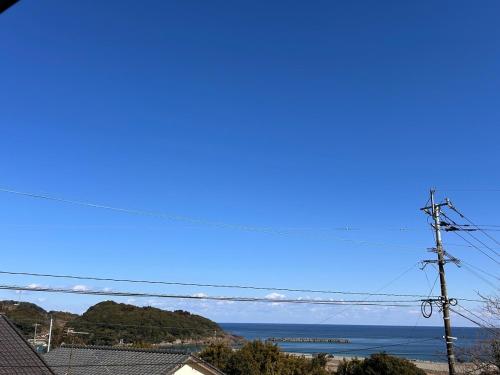 a view of the ocean from a house at VOYAGE Beautiful sunrise ocean view BEDROOM whole house, 2 rooms on 2nd floor, tatami room on 1st floor, &private garage in Hyuga