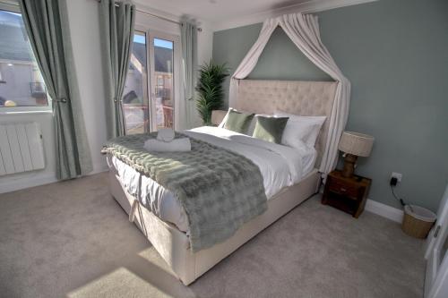 a bedroom with a large bed with a canopy at Luxurious, private rooms in the heart of Galway in Galway