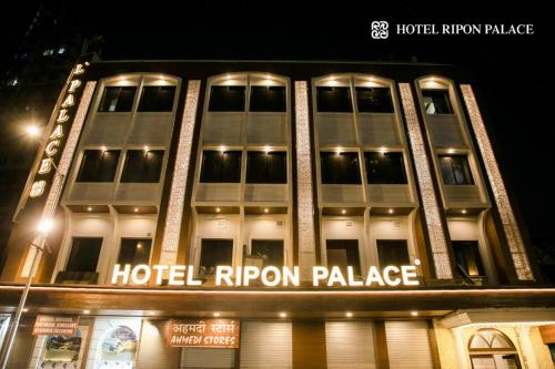 a hotel rippon palace is lit up at night at Hotel Ripon Palace in Mumbai