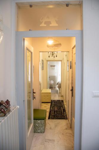 a hallway with a door leading to a living room at Almasol in Cassano delle Murge
