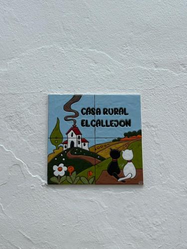 a sign on a wall that reads casa corral education at El callejón in Benarrabá