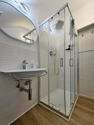 a bathroom with a sink and a shower at Central Apartment Monterosso in Monterosso al Mare