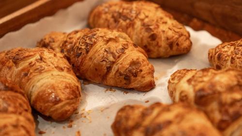 a group of croissants sitting on a baking sheet at Radisson RED London Twickenham in Twickenham