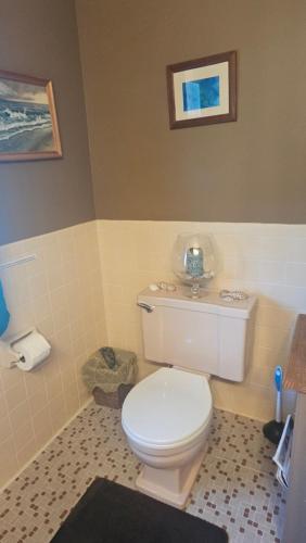 a bathroom with a white toilet in a room at A Salter's Path in Beaufort