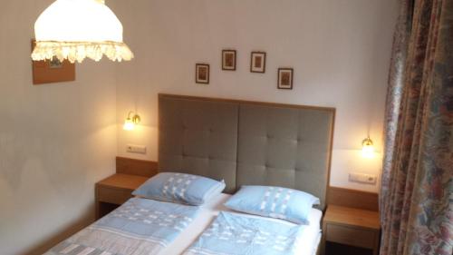 Postel nebo postele na pokoji v ubytování Appartements Tlusel