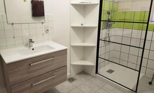 a bathroom with a sink and a shower at Résidence Vacancéole Les Monts Jura in Lélex