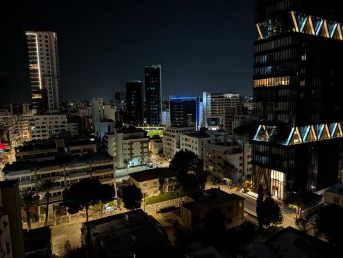 a view of a city at night at Urban Habitat Suites & Condos in Nicosia