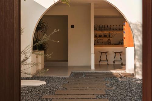 an archway leads into the kitchen and dining room of a house at Mountain Resort Hotel in Dali