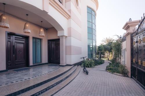 a bike parked on a sidewalk next to a building at Full Moon Guesthouse in Dubai
