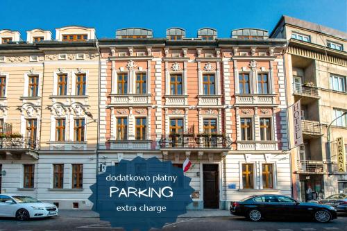 a building with a parking sign in front of it at Amber Boutique Hotels - Amber Design in Krakow