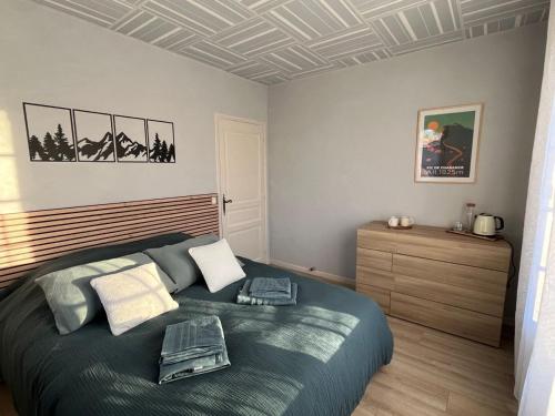 a bedroom with a large bed in a room at L'auberge de Charance in Gap