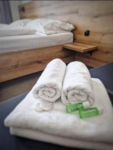 a room with two towels on a table at Hotel U Labutě in Žďár nad Sázavou