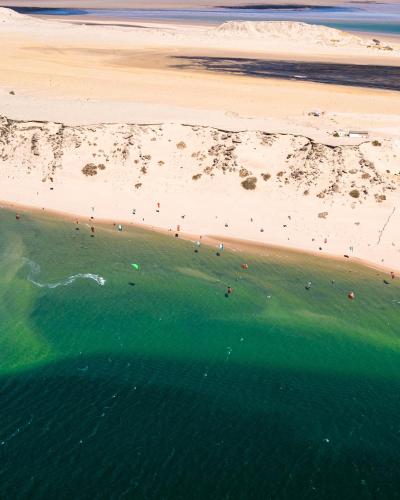 an aerial view of a beach with people in the water at Hotel Dakhla Club & SPA in Dakhla