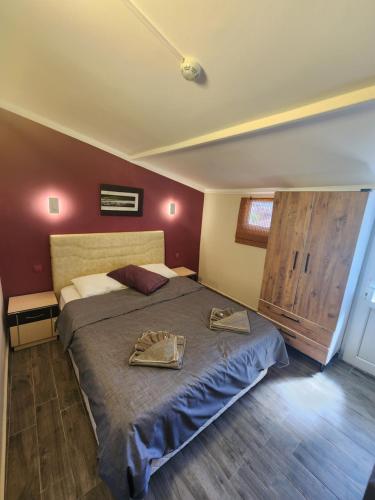 a bedroom with a bed with two plates on it at Şehzade Apart Otel in Fethiye