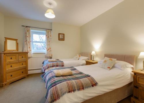 a bedroom with two beds and a window at 3 Bed in Catterick oc-ds934 in Catterick Bridge