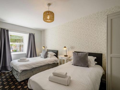 a bedroom with two beds and a window at 2 Bed in Sanquhar oc-89403 in Sanquhar