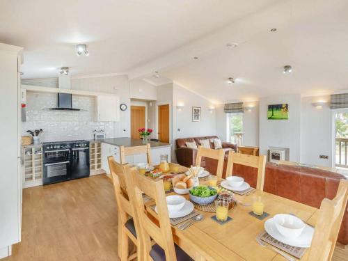 a kitchen and living room with a table and chairs at 3 Bed in St. Andrews oc-88420 in Balmullo