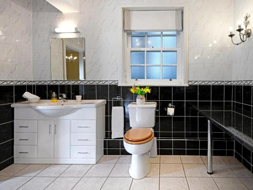 a bathroom with a toilet and a sink at 3 Bed in Annan oc-75355 in Annan