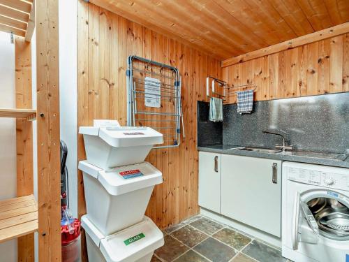 a kitchen with a sink and a washing machine at 3 Bed in Cupar oc-54394 in Peat Inn 