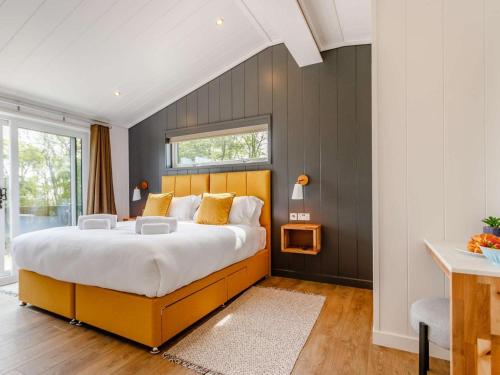 a bedroom with a large bed and a window at 2 Bed in Anstruther oc-83173 in Anstruther