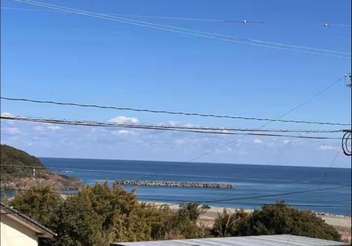 a view of the ocean from a house at VOYAGE Beautiful sunrise ocean view BEDROOM whole house, 2 rooms on 2nd floor, tatami room on 1st floor, &private garage in Hyuga
