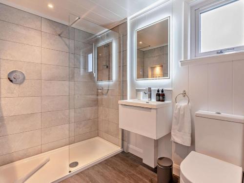 a bathroom with a shower and a toilet and a sink at 2 Bed in St Andrews oc-94606 in St. Andrews