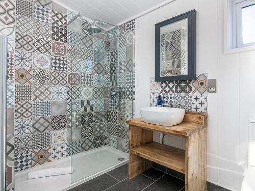 a bathroom with a sink and a shower at 2 Bed in Anstruther oc-72436 in Anstruther