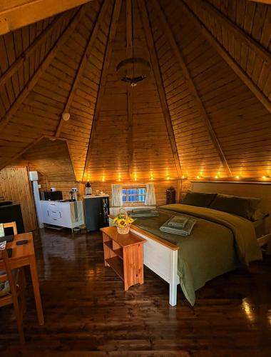 a bedroom with a bed and a table in a room at The Nook Cardross in Cardross