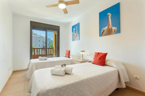 a bedroom with two beds with towels on them at Ojos del Océano in Palm-Mar