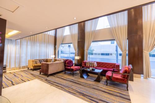 a living room with furniture and a large window at Al Muhaidb Residence Al Malaz 3 - Economic in Riyadh