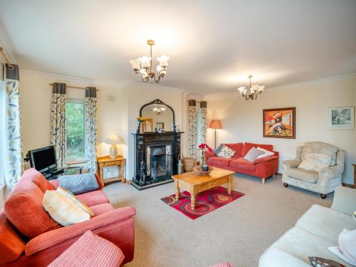 a living room with red furniture and a fireplace at 5 Bed in Mountcharles oc-ii11344 in Mountcharles