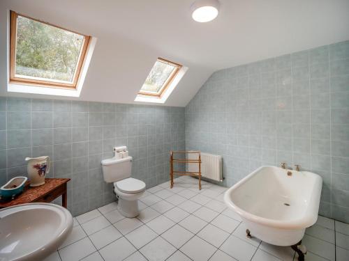 a bathroom with a tub and a toilet and a sink at 5 Bed in Mountcharles oc-ii11344 in Mountcharles