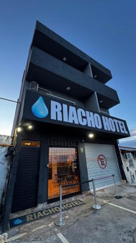 araxo home is shown in front of a building at Riacho Hotel in Brasília