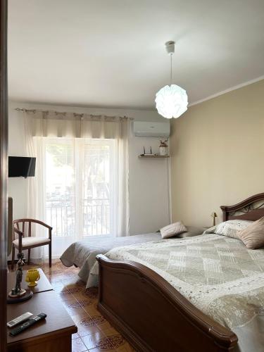 a bedroom with a large bed and a window at La Casa del Sole in Corleone