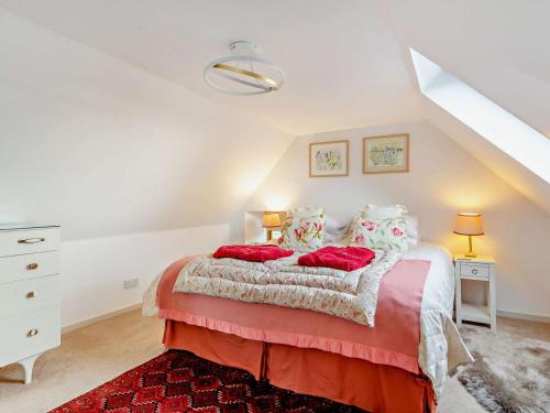 a bedroom with a large bed with red pillows at 1 Bed in Elgin oc-94281 in Elgin