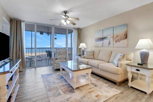 a living room with a couch and a table at Estero Island Beach Villas 105 in Fort Myers Beach