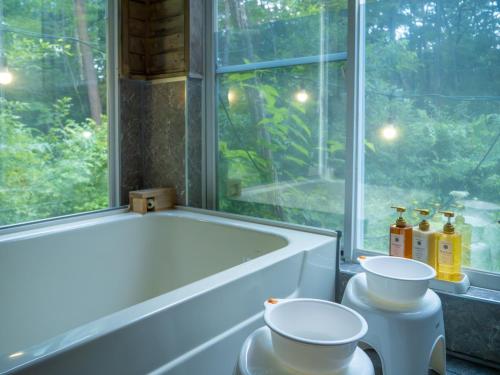 a bath tub in a bathroom with a window at Nasu-gun - House - Vacation STAY 9032 in Anazawa
