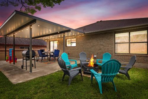 a group of chairs sitting around a fire pit at SeaCasa San Antonio in San Antonio