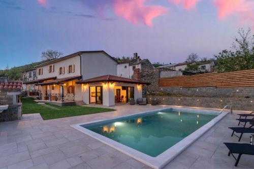a swimming pool in the backyard of a house at Casa Balussi by Briskva in Buzet